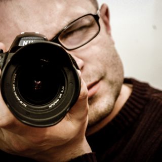 紐約攝影學院 NYIP 攝影學習課程單元概要 man camera photographer lens nikon