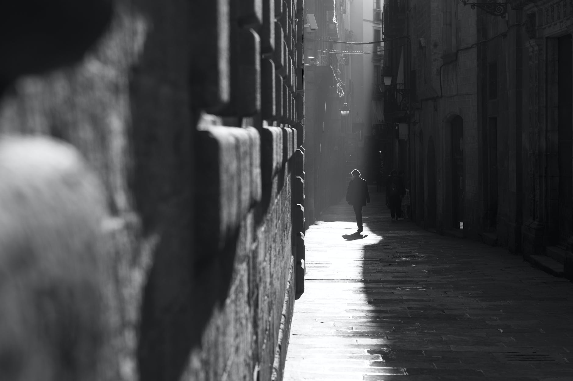 person walking in City town alley